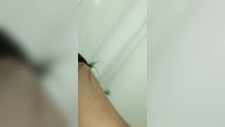 Lusty women plays with the sex toy on the sink