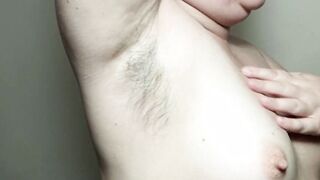 Ellie shows her unshaved armpits and plays with them