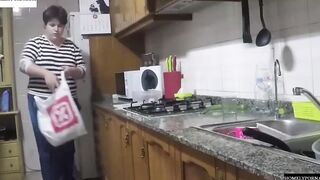 She has arrived from shopping and they nailed inside the kitchen