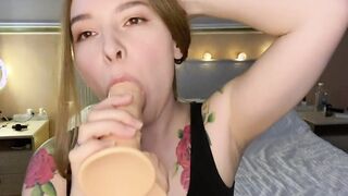 blows sex toy and looks at the camera