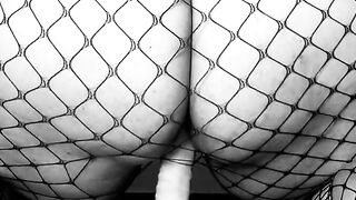 LiaKahn Spanish MILF fucks her sex toy clothed inside a fishnet bodysuit