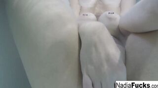 Bombshell Nadia takes a hot tub with some latex duckies