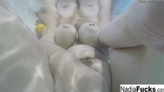 Bombshell Nadia takes a hot tub with some latex duckies