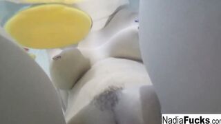 Bombshell Nadia takes a hot tub with some latex duckies