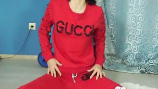 Beauty dark haired milf stretches before fully stripping
