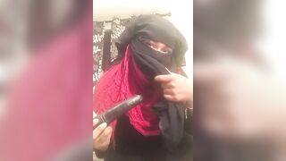 Lonely Niqabi Hijabi woman sucking off vibrator & shaking butt