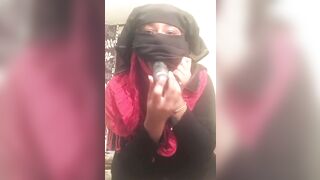 Lonely Niqabi Hijabi woman sucking off vibrator & shaking butt
