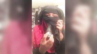 Lonely Niqabi Hijabi woman sucking off vibrator & shaking butt