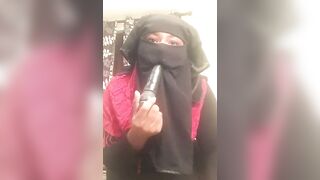 Lonely Niqabi Hijabi woman sucking off vibrator & shaking butt