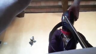 Bound to a machine, masked and hooded, she has to suck a long penis