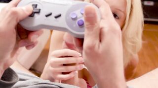 Attractive teenie sucks boyfriends cock while he plays Snes