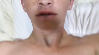Cute twink with tattoos strokes his big dick and cums