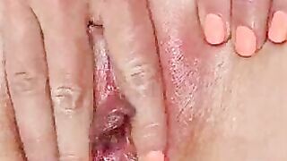 Shaved pussy masturbates