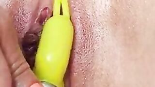 Shaved pussy masturbates