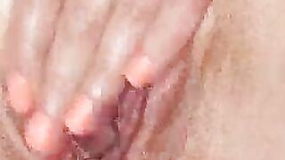 Shaved pussy masturbates
