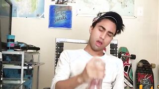Tattooed Latino twink tugging and wanking his big fat cock