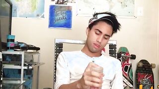 Tattooed Latino twink tugging and wanking his big fat cock