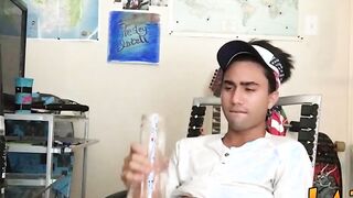 Tattooed Latino twink tugging and wanking his big fat cock