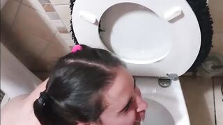 Pigtailed 19 year old blows penis after being pissed on and licking the WC clean | face spitting and slapping