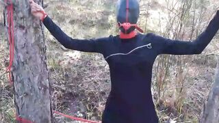 Bound to a tree on a beauty outfit, masked and outdoors deep throat with no mercy