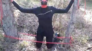 Bound to a tree on a beauty outfit, masked and outdoors deep throat with no mercy