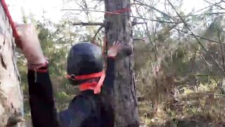 Bound to a tree on a beauty outfit, masked and outdoors deep throat with no mercy