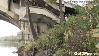 Raven Haired bimbos Pees Near The River