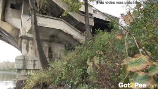 Raven Haired bimbos Pees Near The River