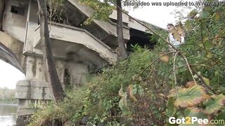 Raven Haired bimbos Pees Near The River