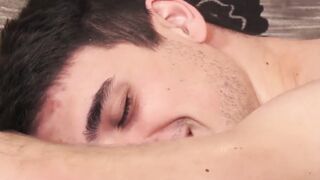 Young men take turn massaging each other and giving head
