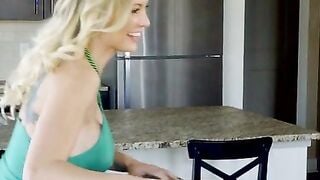 Kenzie Taylor is celebrating St. Patty's Day with a green dress and green beads. The
