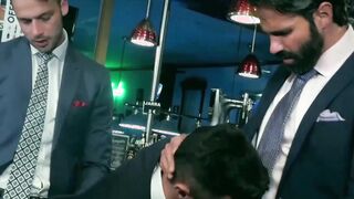 Handsome men in classy suits spitroasting pretty bottom