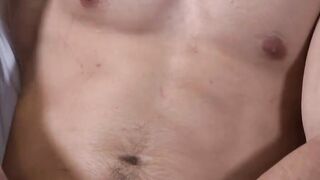 Scott laying back playing with himself while watching porn
