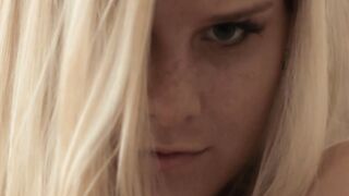 Little blonde bombshell touching herself sensually