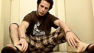 Bearded jock plays with his feet and big hairy dick solo
