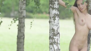 Adorable brunette Gloria Sol shows her natural tits outdoors