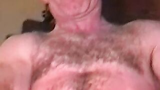 Hairy old guy with mustache plays with his boner all alone