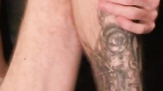 Tattooed amateur plays with his cock and makes it cum hard