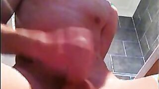 Attractive dude Ashley Ownes pleasures himself in bathroom