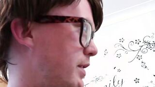 Horny chick sucking nerds cock and licking his balls