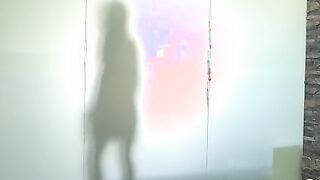 Alexis Brill hoses herself off inside the pool shower before carefully stepping to the changing room where she slips on