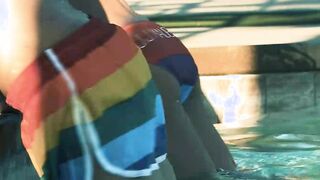 Dalton Riley and Kian Kane bang in front of an LGBT flag