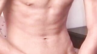 Hung guy tugs his hard hairy dick until spraying a big load