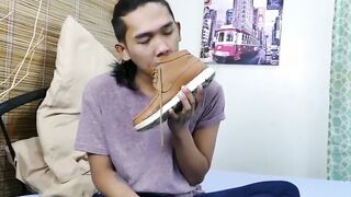 Little Oriental twink sniffs his feet and jerks off