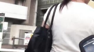 Nerdy Asian cocktease kneels for pissing behind tree