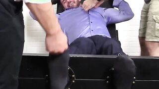 Big muscled Billy laughs hard while tickled on strap chair