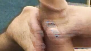Hairy young guy tugs raging dick and cums all over the place