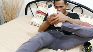 Good looking Asian twink shows his feet and strokes hard