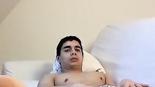 Jock sensually touches both his feet and his dick