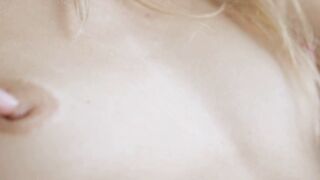 Beautiful young blonde teases her perky tits and wet pussy